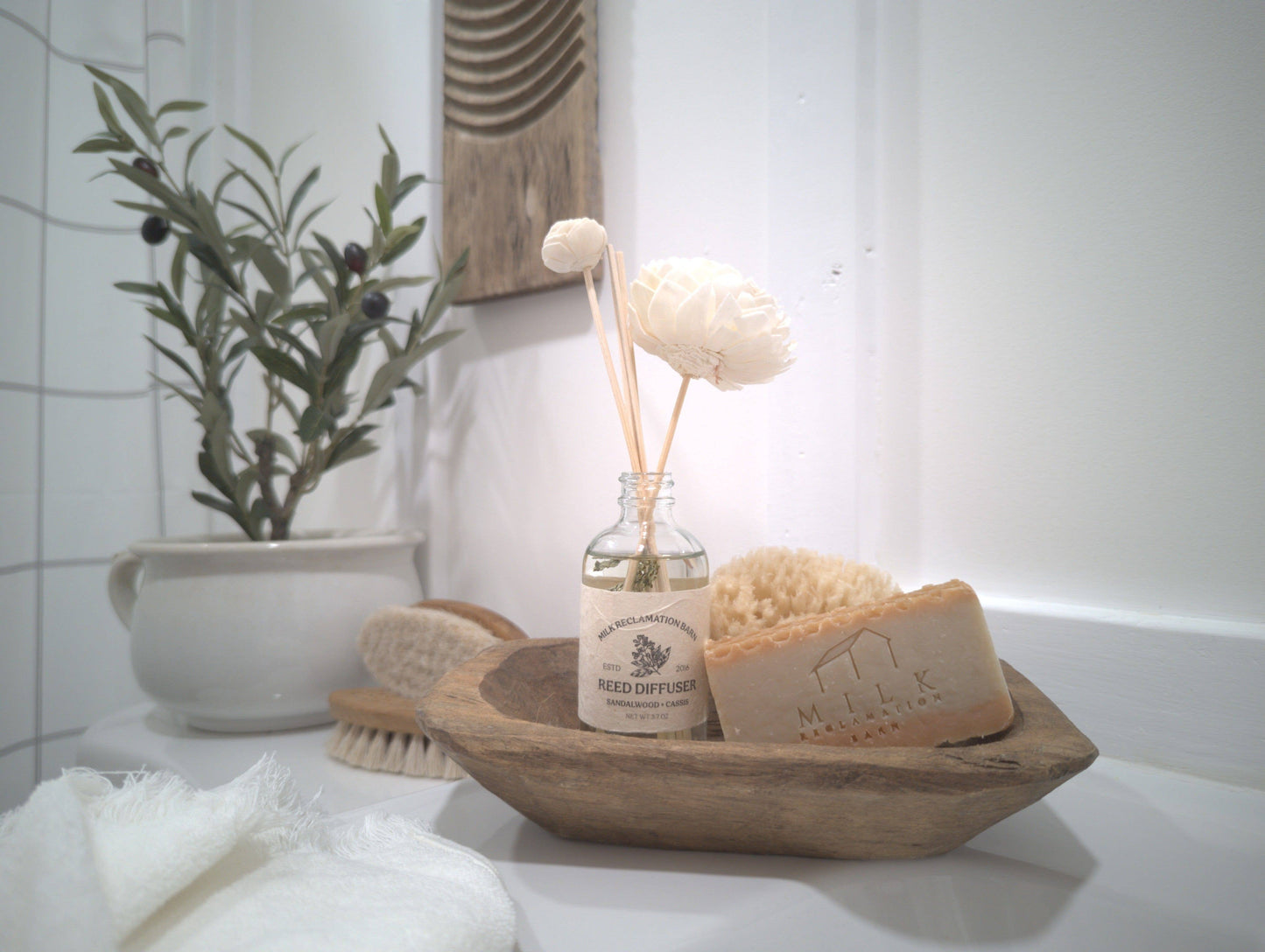 Reed Diffuser with Rattan Reeds and Sola Flowers: Sandalwood + Cassis
